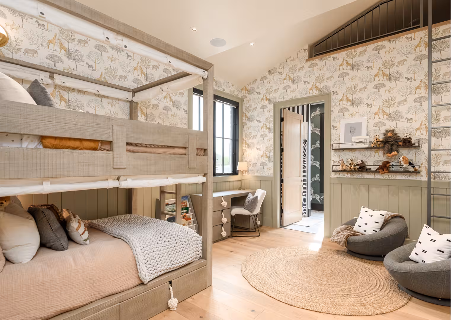 Kids' bedroom in the Draper home with built-in bunk beds and animal print wallpaper
